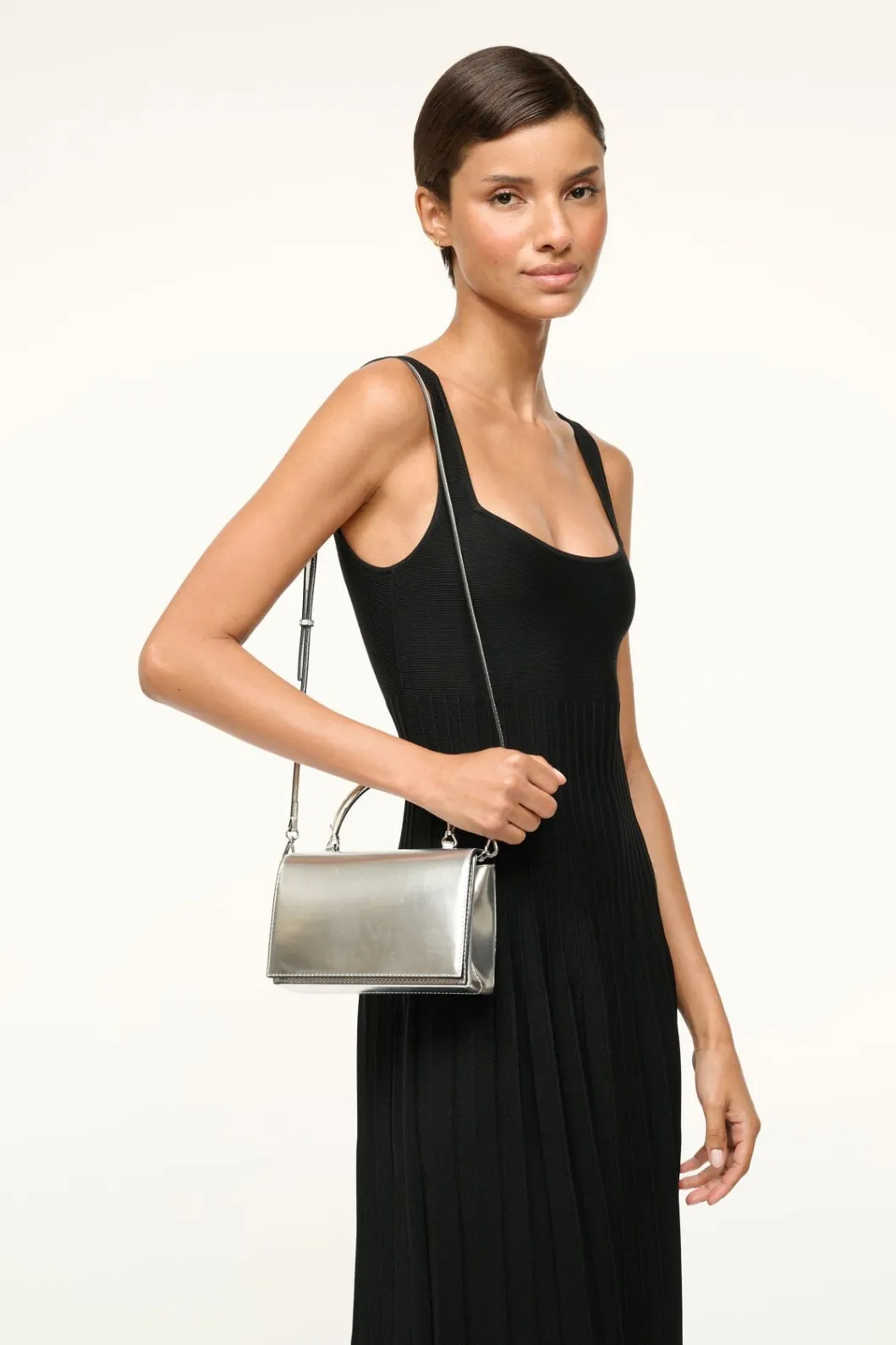 staud_arc_evening_bag_chrome_3.webp STAUD ARC EVENING BAG< The Evening Edit