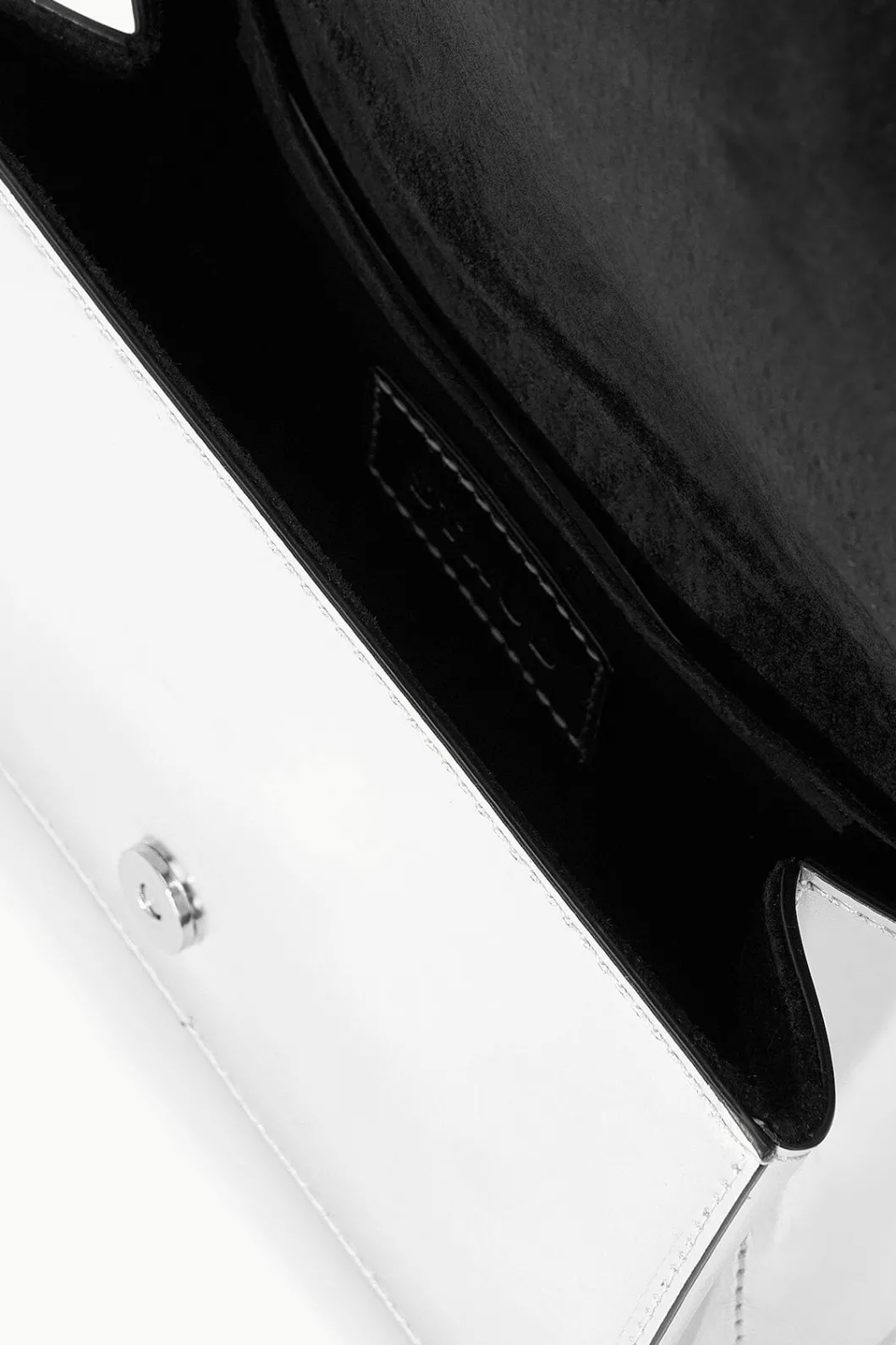 staud_arc_evening_bag_chrome_6.webp STAUD ARC EVENING BAG< The Evening Edit