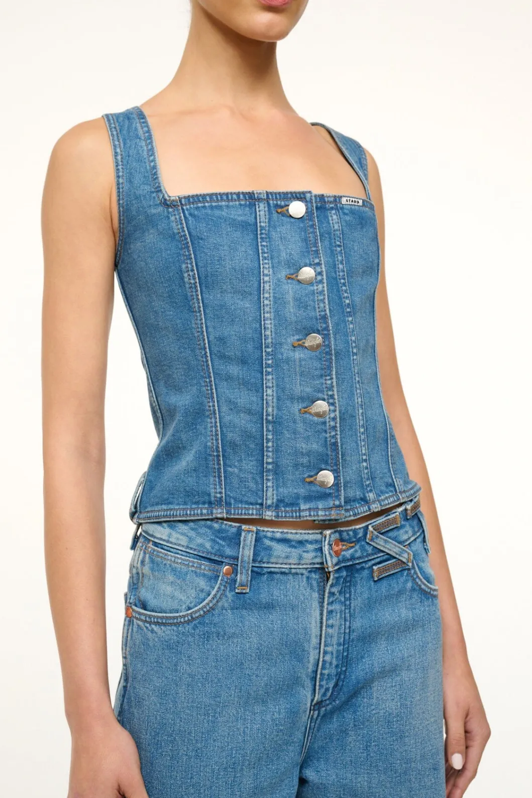 staud_wrangler_trucker_top_indigo_wash_3.webp STAUD WRANGLER TRUCKER TOP INDIGO WASH< Denim | Tops